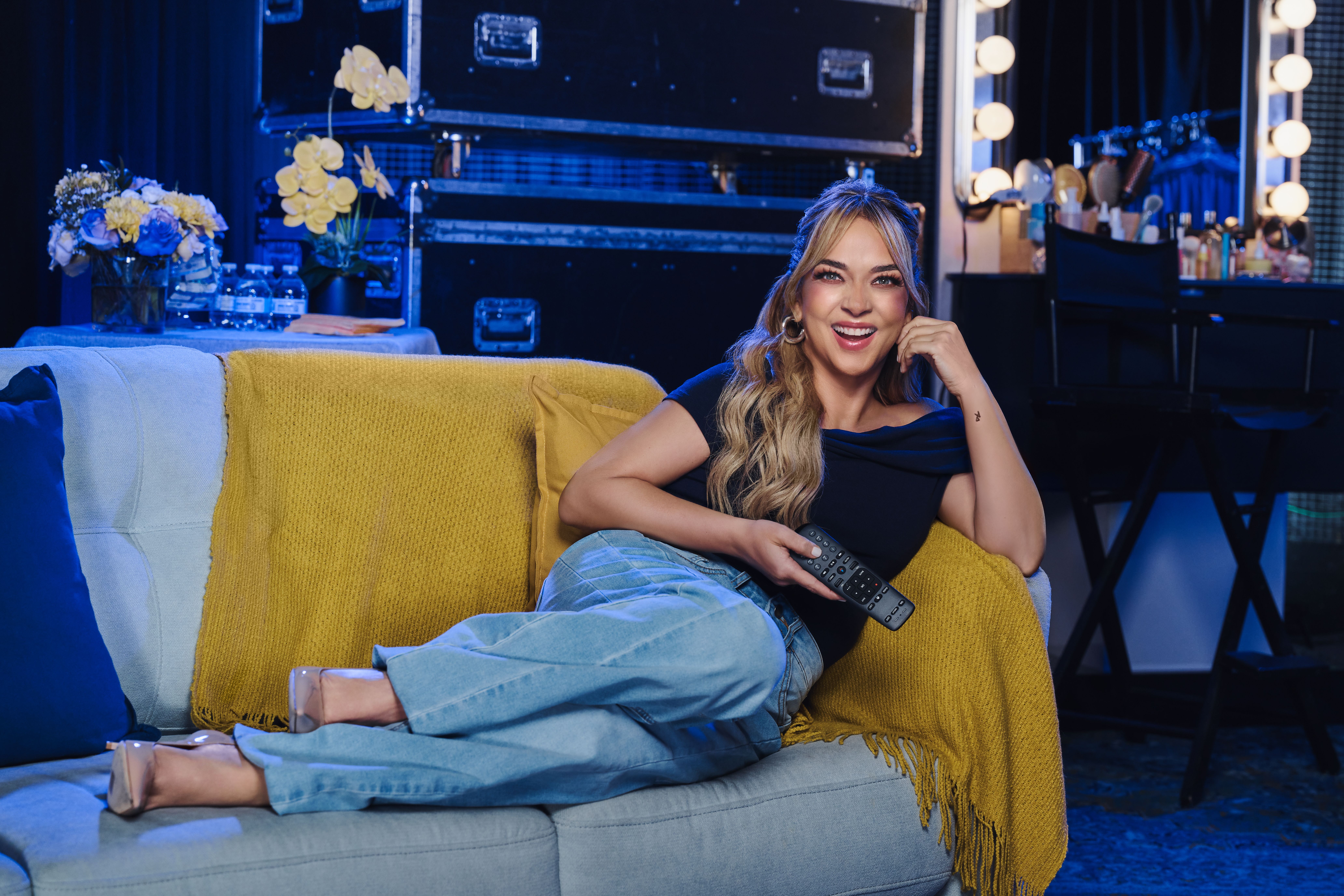 Adamari Lopez watching DirecTV backstage